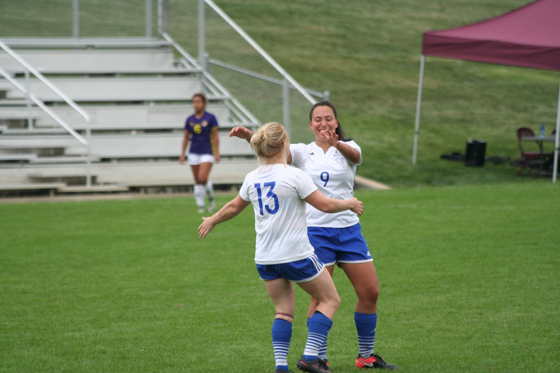 Sophomore's Maddy Duncan and Tessa Calabria celebrating after a goal.